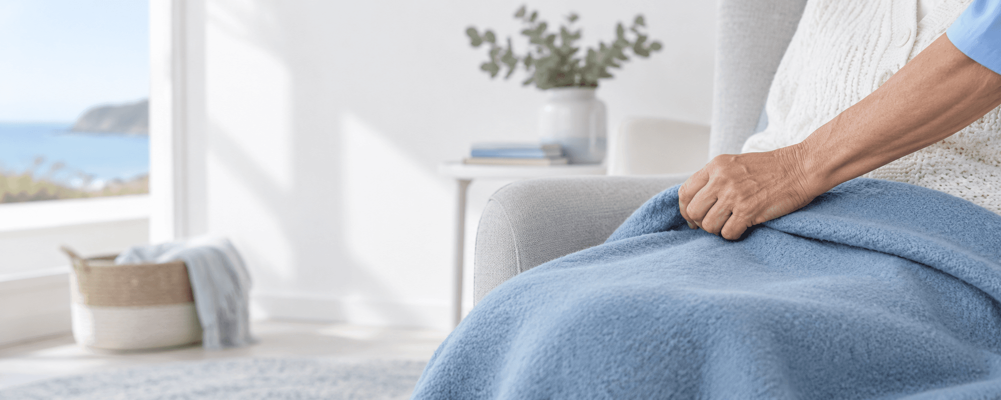 AI-generated illustration of a mature female carer's hand gently adjusting a blue blanket over an elderly client's lap.